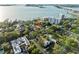 Scenic aerial of neighborhood with water view, city buildings, and clear skies at 608 Orange Ave, Clearwater, FL 33756