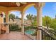 Balcony features tile flooring, ornate pillars, and overlooks a pool at 608 Orange Ave, Clearwater, FL 33756