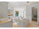 Spacious bathroom with a large tub, tile flooring, double sink vanity and walk-in closet at 608 Orange Ave, Clearwater, FL 33756
