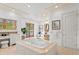 Spacious bathroom featuring a soaking tub, vanity, access to the balcony, and tiled floors at 608 Orange Ave, Clearwater, FL 33756
