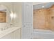 Bathroom showcasing a vanity, toilet, and shower/tub with a tile surround at 608 Orange Ave, Clearwater, FL 33756