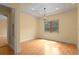 Bright bedroom featuring hardwood floors, a tray ceiling, and a large window at 608 Orange Ave, Clearwater, FL 33756