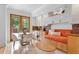 Cozy dining area with custom built-ins, an orange bench, and views to the outside at 608 Orange Ave, Clearwater, FL 33756