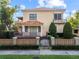 Charming two-story home featuring a tile roof, balcony, and manicured landscaping at 608 Orange Ave, Clearwater, FL 33756
