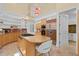 Open-concept kitchen with a central island, stainless steel appliances, and ample storage at 608 Orange Ave, Clearwater, FL 33756