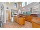 Open concept kitchen with center island, custom cabinetry and stainless steel appliances at 608 Orange Ave, Clearwater, FL 33756