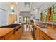 Gourmet kitchen featuring an island cooktop, stainless appliances, and custom cabinets at 608 Orange Ave, Clearwater, FL 33756