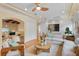 Comfortable living room with a ceiling fan, neutral colors, and access to the desk nook at 608 Orange Ave, Clearwater, FL 33756