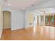 Expansive living room with wood floors, archways, and French doors to outdoor living at 608 Orange Ave, Clearwater, FL 33756