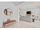 Bright and spacious living room features modern decor, tile floors, and an elegant staircase at 608 Orange Ave, Clearwater, FL 33756