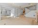 Large, open living space featuring tile floors, staircase and seamless flow into other areas of the house at 608 Orange Ave, Clearwater, FL 33756