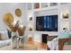 Modern living room featuring a custom built-in entertainment center with a flat-screen TV and stylish decor at 608 Orange Ave, Clearwater, FL 33756