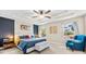 Spacious main bedroom with tray ceiling, ceiling fan, and large windows at 6318 S Harold Ave, Tampa, FL 33616