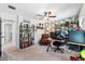 Spacious office featuring an expansive desk setup, leather armchair, bookshelf, and neutral carpeted floors at 6318 S Harold Ave, Tampa, FL 33616