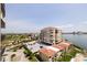 Elevated view of luxurious condos, featuring lush landscaping and convenient parking at 6372 Palma Del Mar S Blvd # 1007, St Petersburg, FL 33715