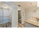 Bathroom featuring a walk-in closet, shower room and granite vanity at 6372 Palma Del Mar S Blvd # 1007, St Petersburg, FL 33715