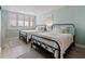 Bedroom features twin beds with wood look floors and window with lovely waterfront views at 6372 Palma Del Mar S Blvd # 1007, St Petersburg, FL 33715