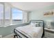 Bedroom with a view featuring shuttered windows and cozy decor at 6372 Palma Del Mar S Blvd # 1007, St Petersburg, FL 33715
