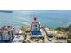 Aerial view of the oceanfront condo building with a pool and parking at 6372 Palma Del Mar S Blvd # 1007, St Petersburg, FL 33715