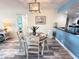 Charming dining area with a round table, stylish chairs, and modern light fixture at 6372 Palma Del Mar S Blvd # 1007, St Petersburg, FL 33715