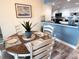 A beautifully set dining table complements the adjacent kitchen and overall open concept at 6372 Palma Del Mar S Blvd # 1007, St Petersburg, FL 33715