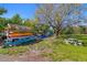 Outdoor kayak storage rack and picnic table, surrounded by lush landscaping at 6372 Palma Del Mar S Blvd # 1007, St Petersburg, FL 33715