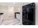 Spacious kitchen with stainless steel appliances, white cabinets and stylish wood flooring at 6372 Palma Del Mar S Blvd # 1007, St Petersburg, FL 33715