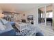 Bright living room with a view to the lanai, comfortable seating, and open to dining area at 6372 Palma Del Mar S Blvd # 1007, St Petersburg, FL 33715