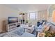 Bright living room with water views and balcony access at 6372 Palma Del Mar S Blvd # 1007, St Petersburg, FL 33715