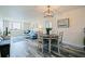 Open-concept living space with combined living room and dining area, with ample light and water views at 6372 Palma Del Mar S Blvd # 1007, St Petersburg, FL 33715