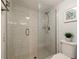 An elegant shower room with a frameless glass door, tile walls, and a rain shower head at 6372 Palma Del Mar S Blvd # 1007, St Petersburg, FL 33715