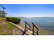 Community water access featuring concrete stairs leading to calm waters with waterfront view at 6372 Palma Del Mar S Blvd # 1007, St Petersburg, FL 33715