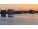 Tranquil waterfront scene at twilight with city lights shimmering across the water's surface at 6372 Palma Del Mar S Blvd # 1007, St Petersburg, FL 33715