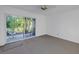 Well-lit bedroom featuring a ceiling fan and sliding glass doors to a private patio at 6826 Stones Throw N Cir # 11104, St Petersburg, FL 33710