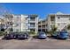 Attractive condominium building with reserved covered parking and balconies for residents and guests at 6826 Stones Throw N Cir # 11104, St Petersburg, FL 33710