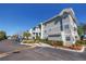 Exterior of condo buildings with balconies and well-maintained landscaping, creating an inviting community environment at 6826 Stones Throw N Cir # 11104, St Petersburg, FL 33710