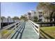 Condominium exterior view from the bridge over the canal on a sunny day at 6826 Stones Throw N Cir # 11104, St Petersburg, FL 33710