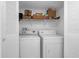 Convenient laundry closet with full-size washer and dryer, with storage shelf at 6826 Stones Throw N Cir # 11104, St Petersburg, FL 33710