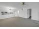 Spacious living room showing dining area and pass through to kitchen, with neutral carpet at 6826 Stones Throw N Cir # 11104, St Petersburg, FL 33710