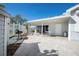 Outdoor patio area with BBQ grill, covered space, and brick pavers, ideal for outdoor gatherings and relaxation at 6826 Stones Throw N Cir # 11104, St Petersburg, FL 33710