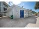 View of the pool house featuring showers and restrooms with brick flooring and white vinyl siding at 6826 Stones Throw N Cir # 11104, St Petersburg, FL 33710