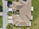 Overhead view of home featuring a courtyard and well-manicured lawn at 767 Tremont Greens Ln # 64, Sun City Center, FL 33573