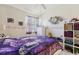 Inviting bedroom featuring a butterfly themed bed, soft lighting, and coordinated decor at 767 Tremont Greens Ln # 64, Sun City Center, FL 33573
