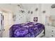 Bright bedroom featuring a decorative theme, coordinated decor, and ample storage space at 767 Tremont Greens Ln # 64, Sun City Center, FL 33573