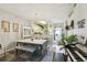 Elegant dining area with a modern table, chandelier, and seamless flow to the living space at 767 Tremont Greens Ln # 64, Sun City Center, FL 33573