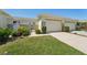 Charming condo with well manicured lawn, metal gate and two car garage at 767 Tremont Greens Ln # 64, Sun City Center, FL 33573