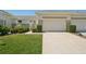 Charming condo with well manicured lawn, metal gate and two car garage at 767 Tremont Greens Ln # 64, Sun City Center, FL 33573