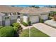 Charming condo with manicured lawn, metal gate, and two car garage at 767 Tremont Greens Ln # 64, Sun City Center, FL 33573