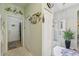 Inviting foyer with tiled floor, decorative accents, and a glass front door at 767 Tremont Greens Ln # 64, Sun City Center, FL 33573