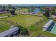 Overhead view of bowling green, meticulously maintained with benches and shade structures at 767 Tremont Greens Ln # 64, Sun City Center, FL 33573